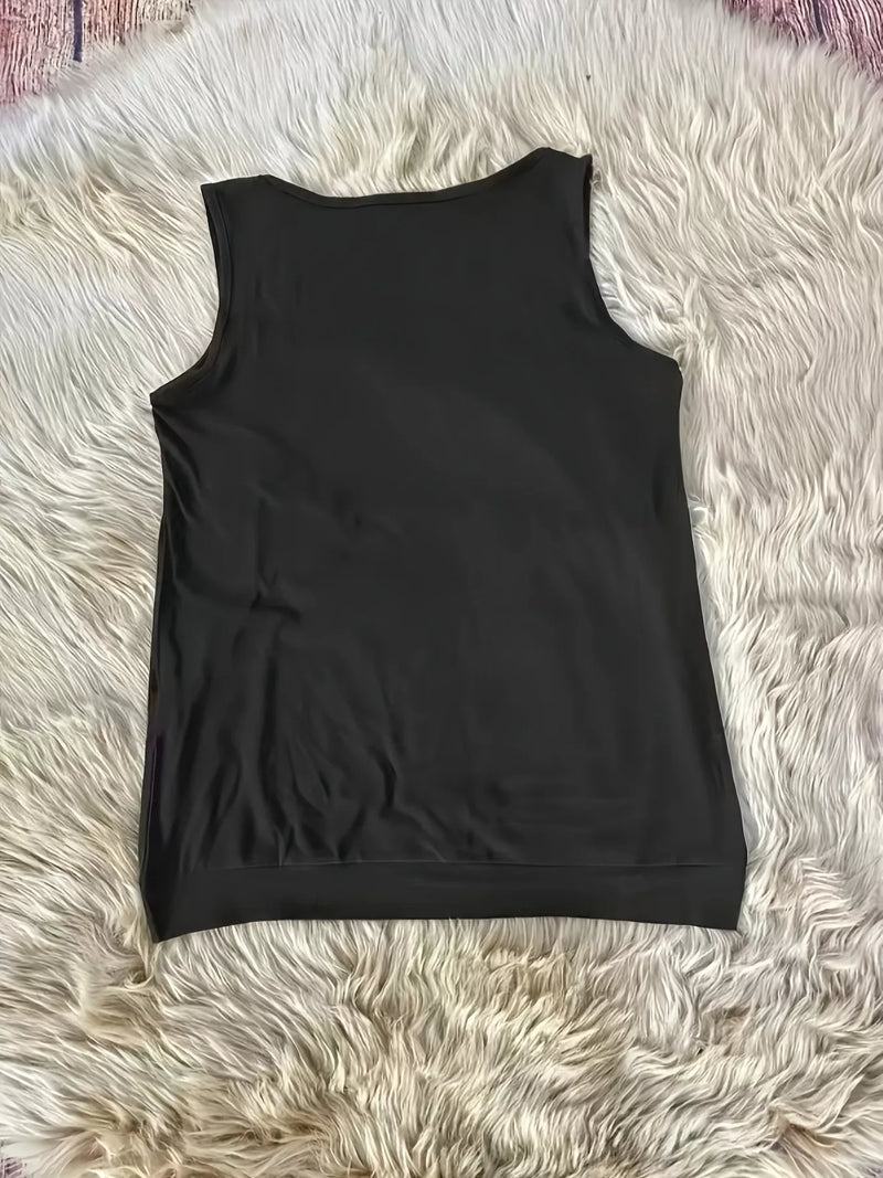 Black sleeveless top on a fluffy white surface
