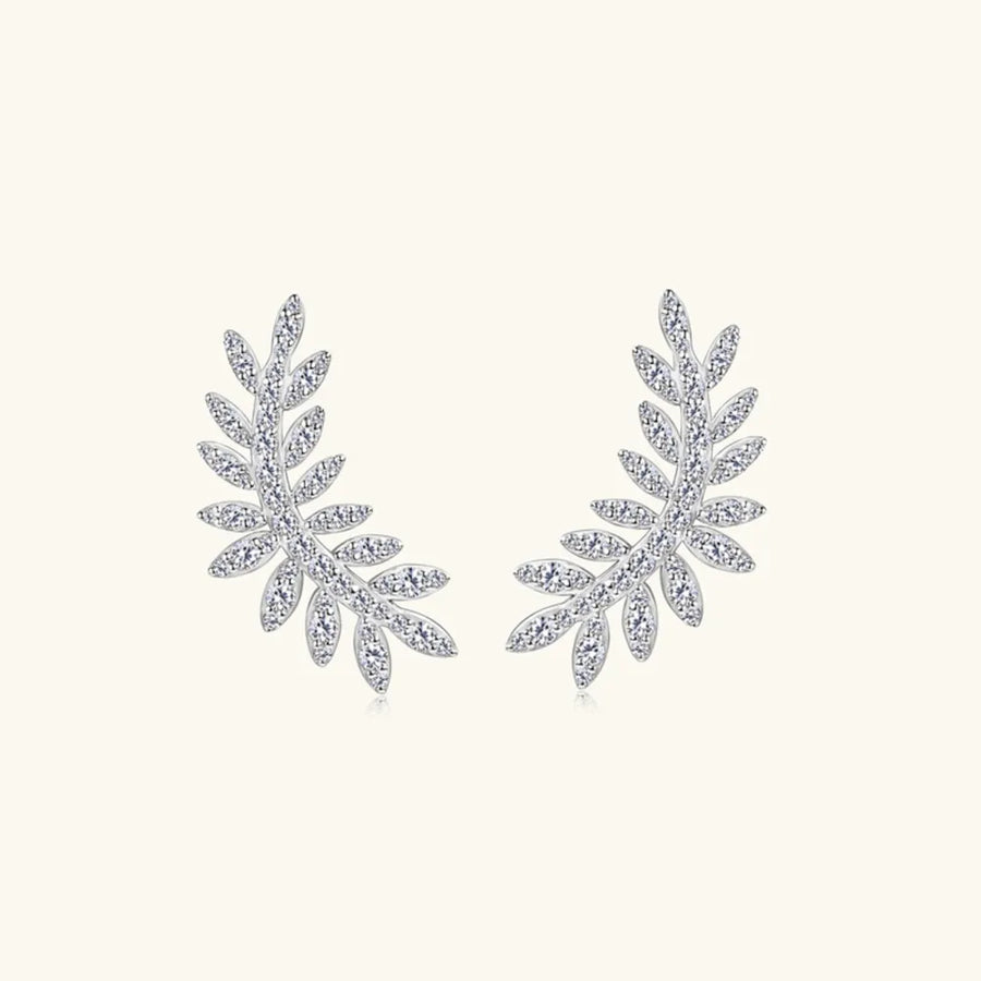 Pair of silver leaf-shaped earrings on a white background