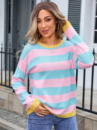 Woman wearing pink and blue sweater