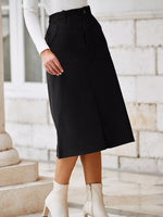 Person wearing a black skirt with white shoes in an outdoor setting