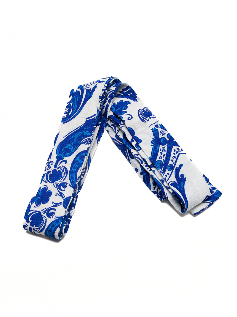Blue and white patterned fabric roll on a white background