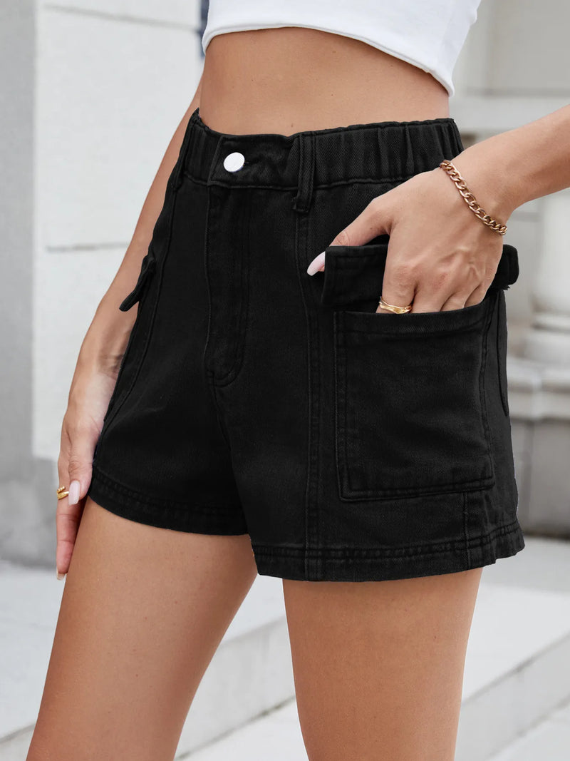 Person wearing black shorts with a blurred background