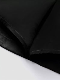 Close-up of black fabric texture on a white background