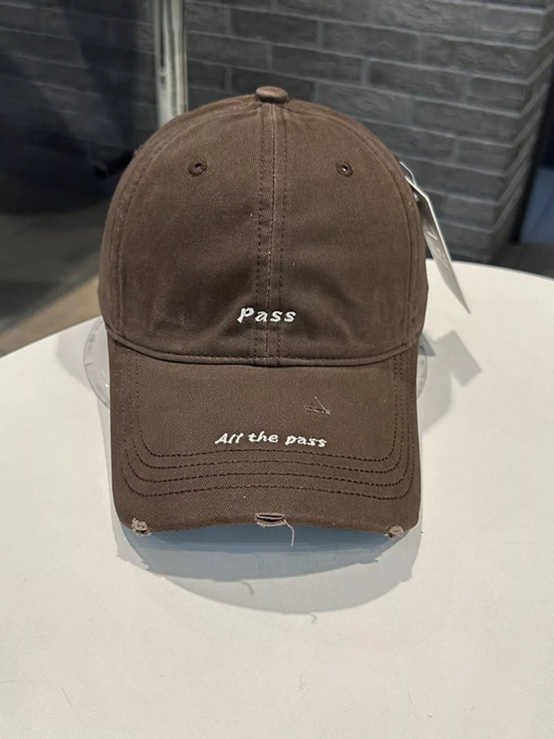 Brown cap with text on a white surface