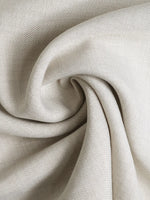 Close-up of beige fabric with a textured pattern
