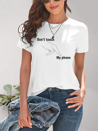Person wearing a white t-shirt with 'Don't touch my phone' text and graphic.