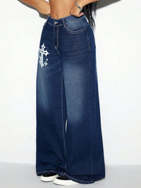 Blue jeans with a white cross design on a white background