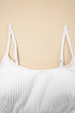 White ribbed tank top on a beige background
