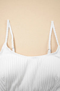 White ribbed tank top on a beige background