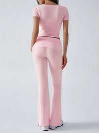 Person wearing a pink outfit on a white background