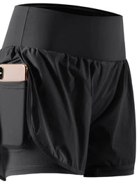Black athletic shorts with a pocket holding a phone on a white background