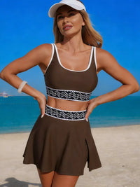 Woman in a brown swimsuit with a white cap on a beach