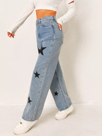Light blue jeans with star patches worn by a person on a white background