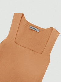 Brown sleeveless top with a brand label on a light gray background
