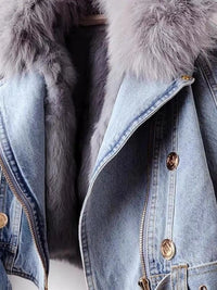 Denim jacket with fur lining and gold buttons on a white background