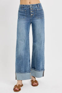 Wide-leg jeans with button fly on a white background