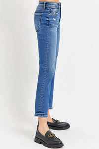 Blue jeans worn by a person on a white background