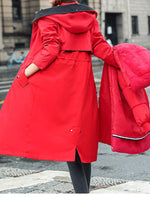Lady showing a view from the back with her hand in her pocket of Women's Detachable Longline Hooded Parka with Faux Fur Trim and Drawstring Waist