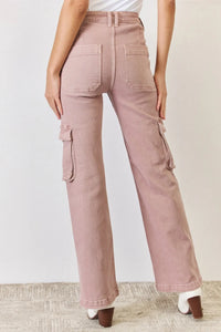 Pink cargo pants worn by a person on a plain background