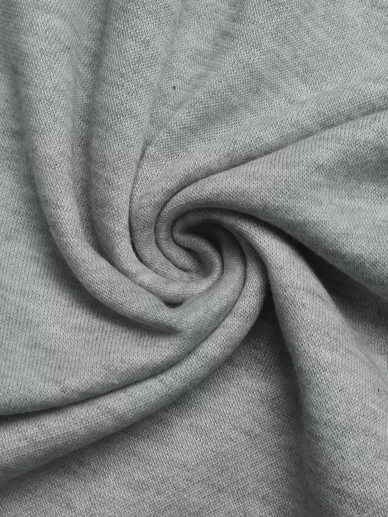 Close-up of gray fabric with a swirl pattern