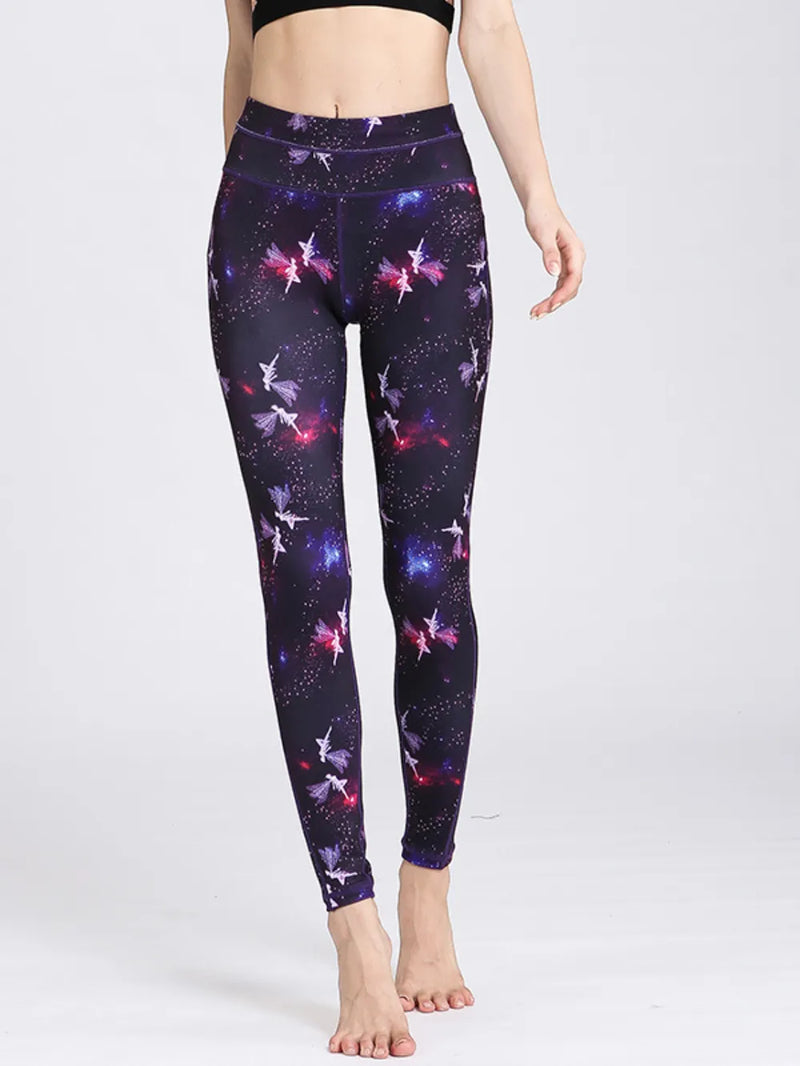 Leggings with a galaxy and fairy design worn by a person on a white background