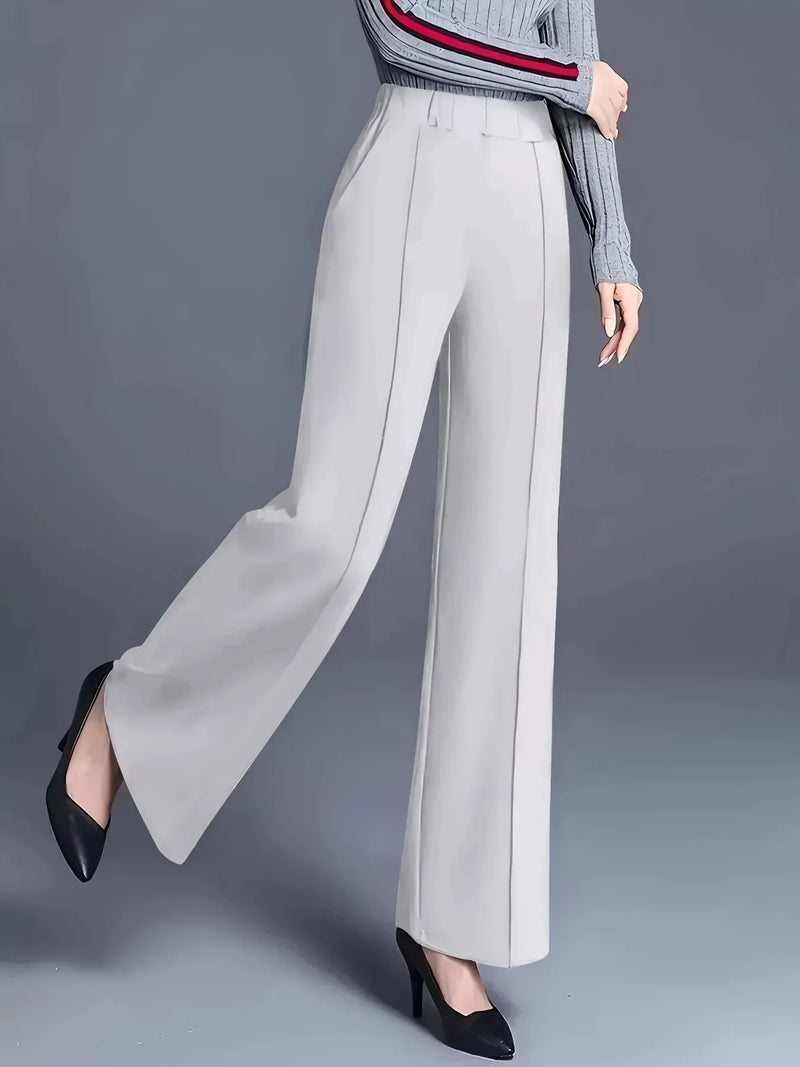 Light gray wide-leg pants worn by a person on a gray background