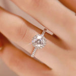 Silver ring with a large diamond on a blurred background
