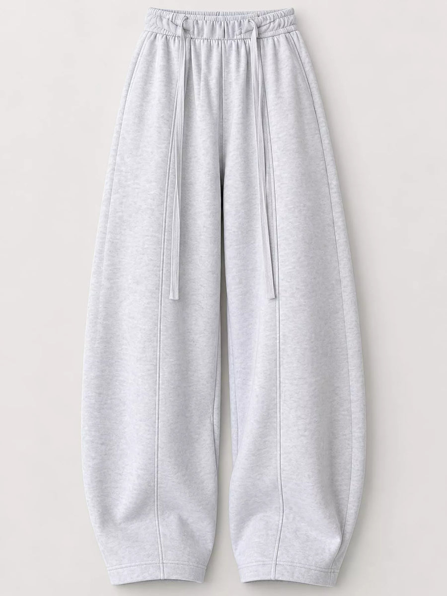Light gray heather sweatpants with an elastic drawstring waist and wide legs, shown flat against a light beige background.
