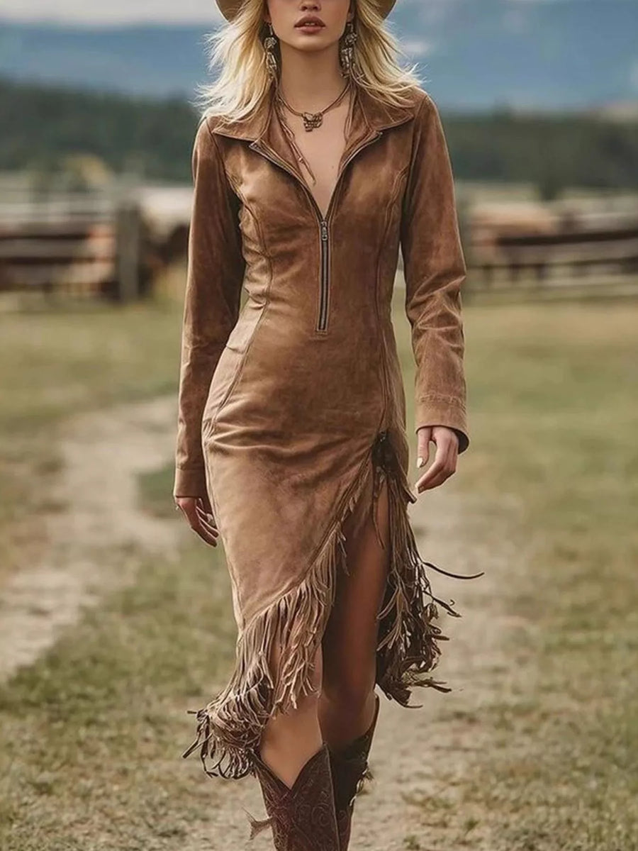 Woman wearing a brown suede dress with fringe in a rural setting