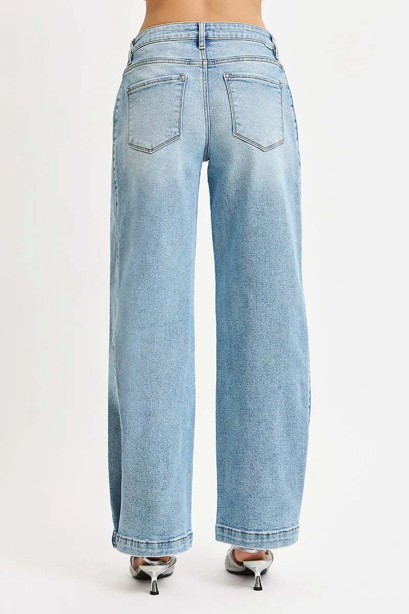Light blue jeans worn by a person on a white background