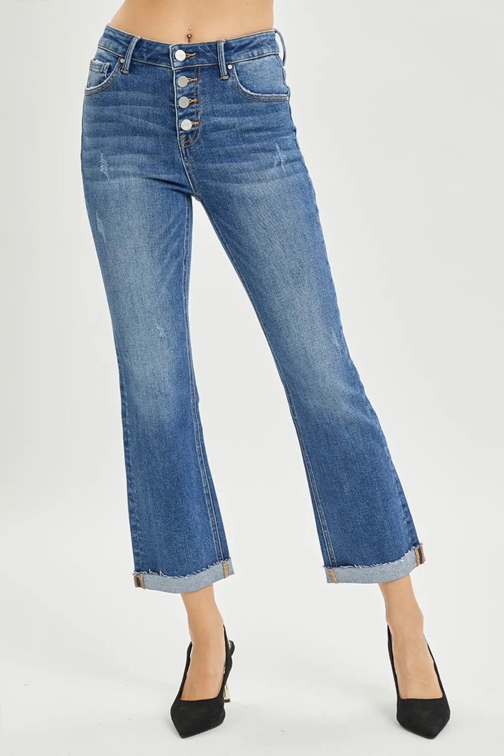 Blue jeans with button fly on a white background
