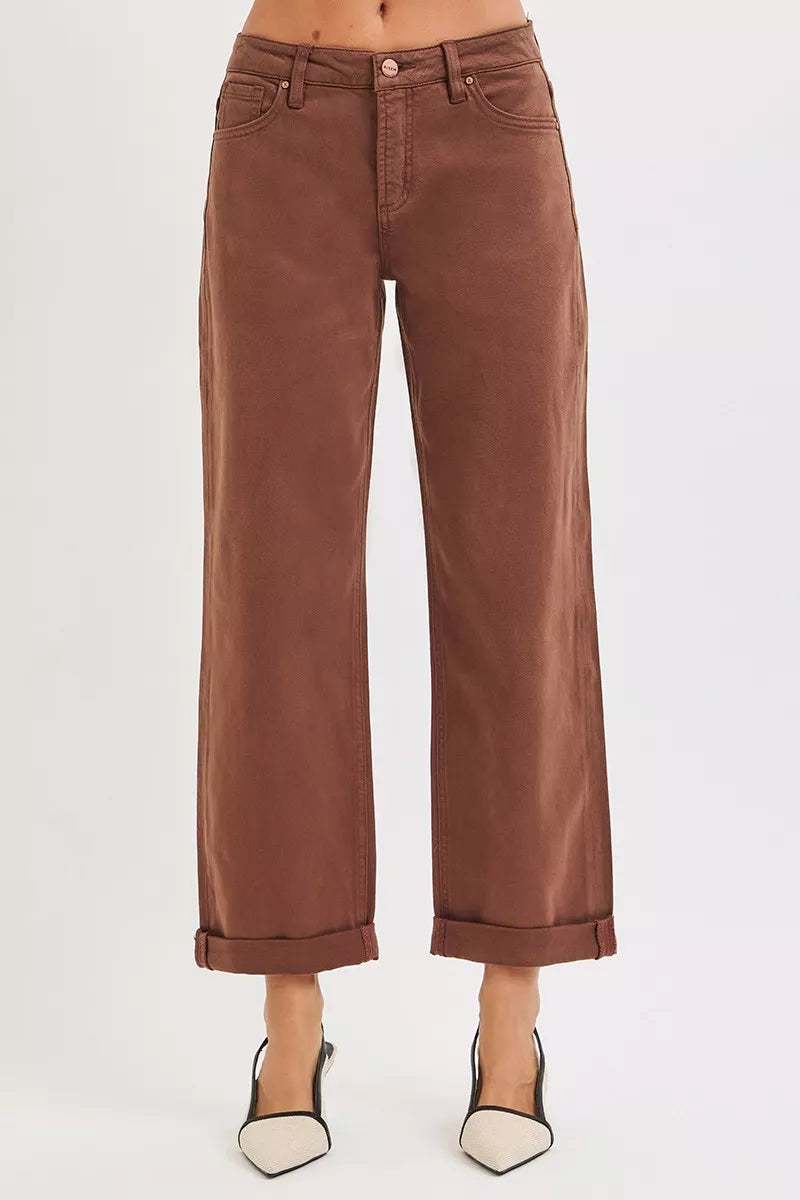 Brown wide-leg jeans on a white background