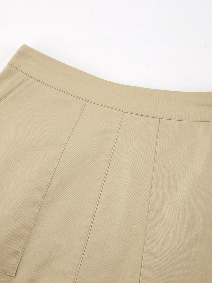 Close-up of beige pants with a white background