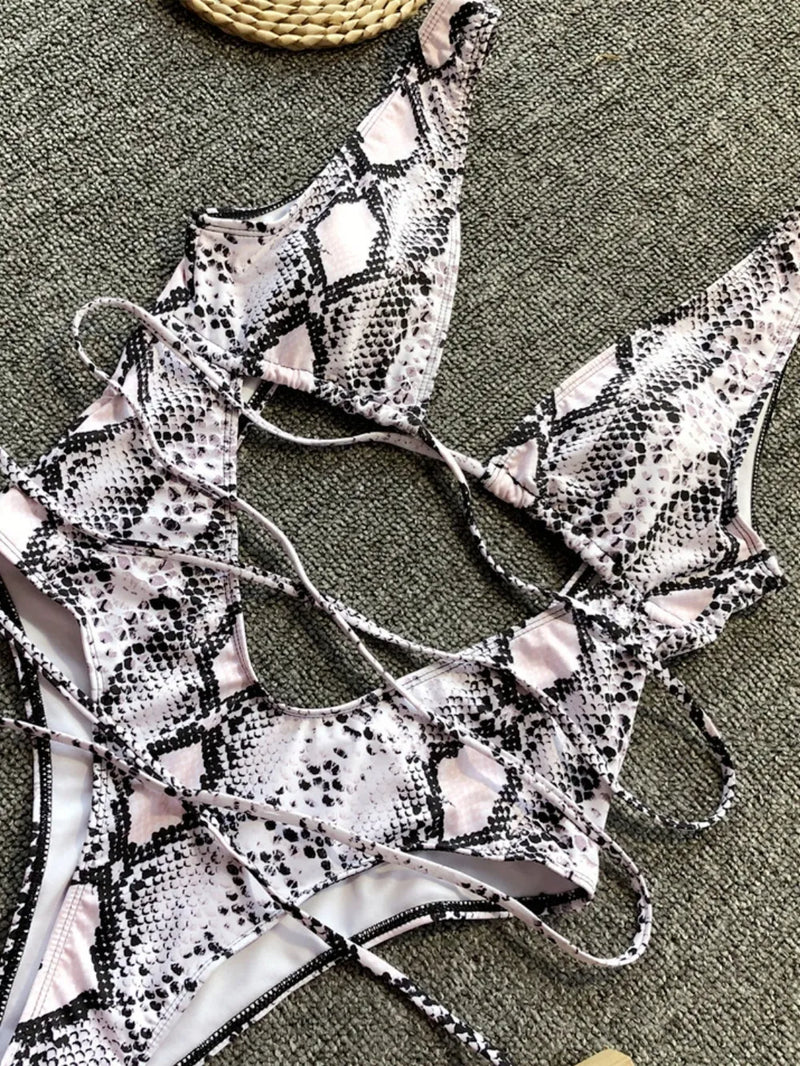 Snake print bikini set on a textured surface