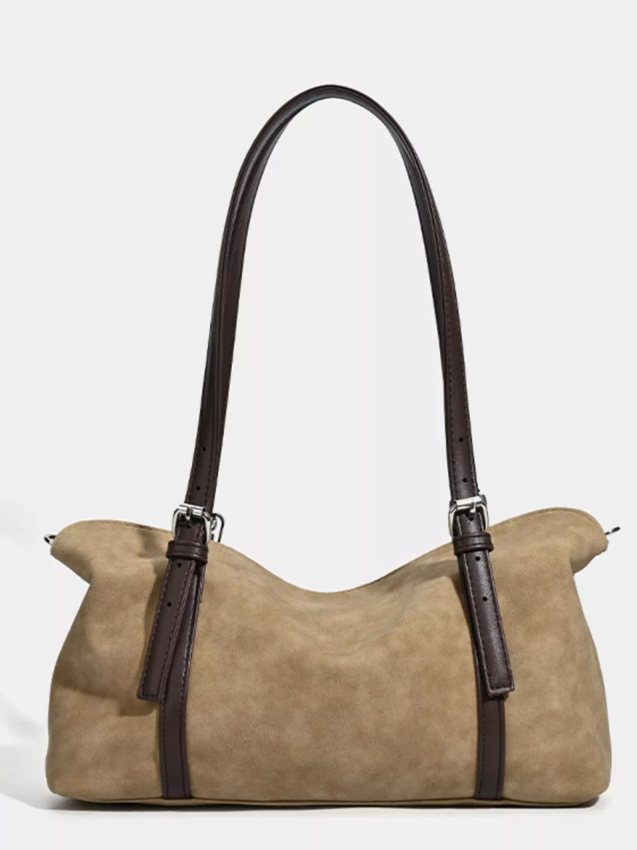 Beige handbag with brown straps on a white background