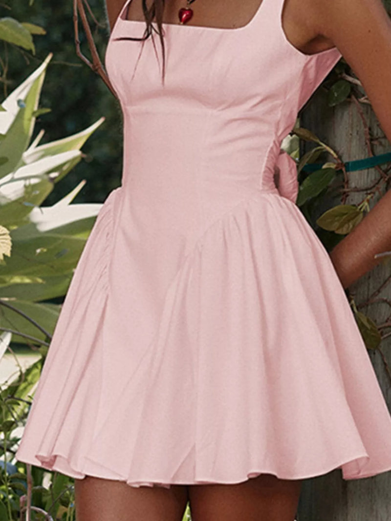 Pink dress worn by a person with a blurred background