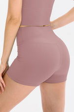 Mauve ribbed shorts worn by a person on a white background