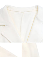 Close-up of a white fabric texture with a subtle pattern.