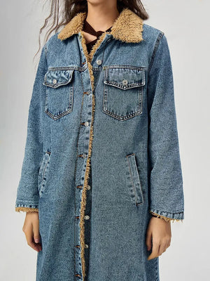 Denim coat with beige sherpa lining on a plain background