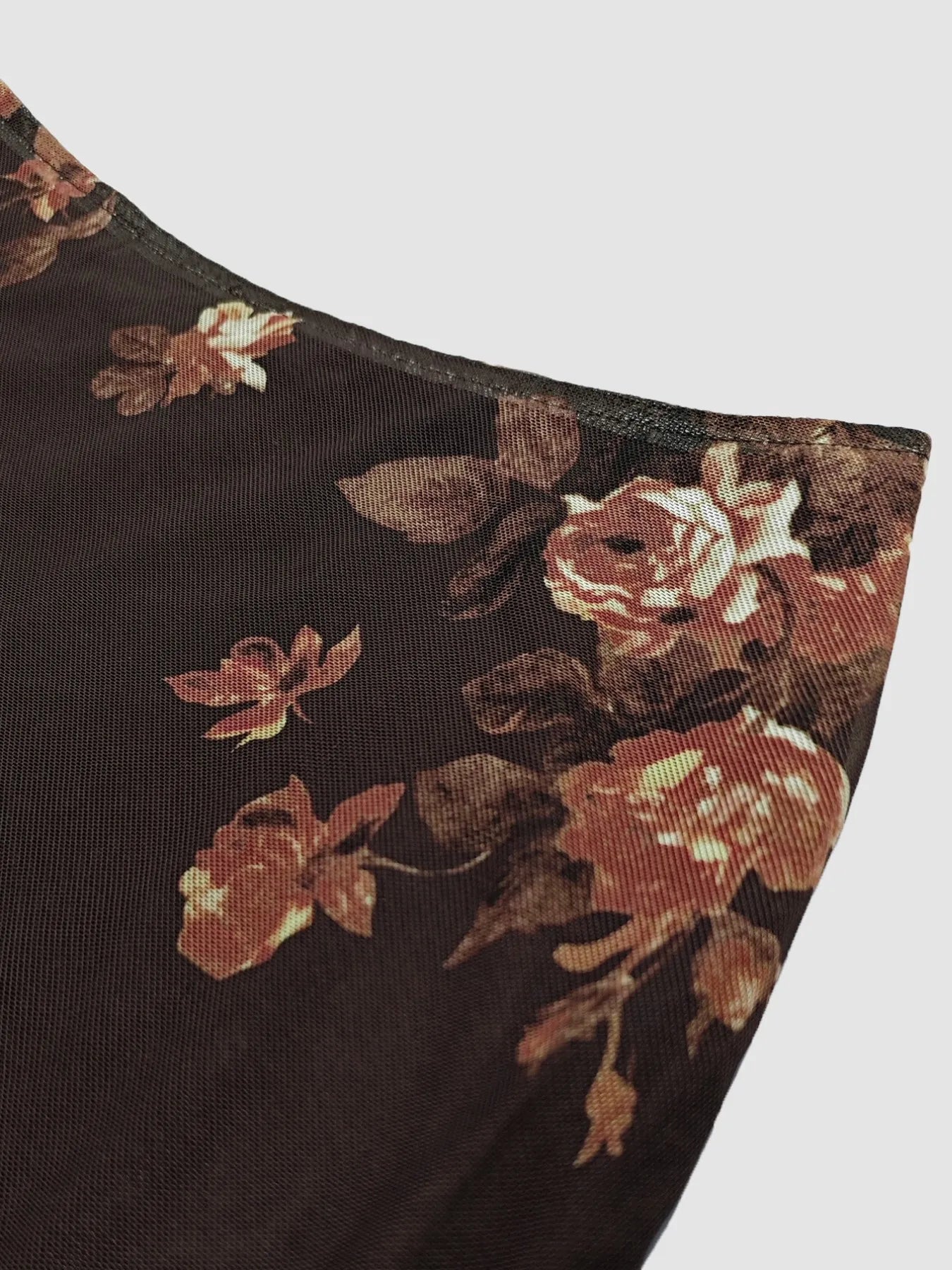 Floral patterned fabric on a dark background