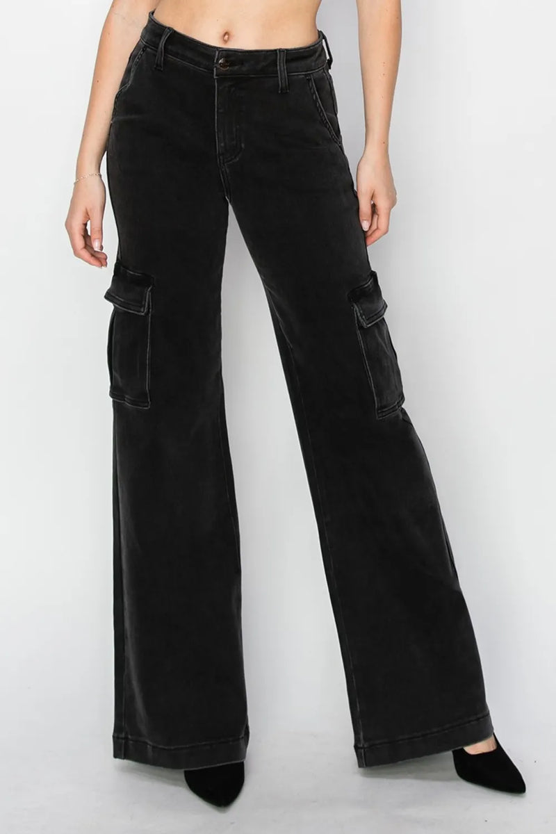 Black cargo pants worn by a person on a white background