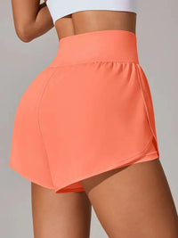 Person wearing a coral athletic skirt on a plain background