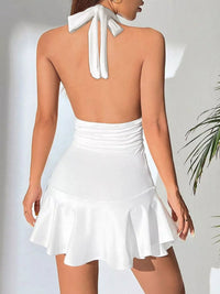 White halter top and skirt set on a plain background