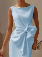 Light blue dress with a large bow detail on a neutral background