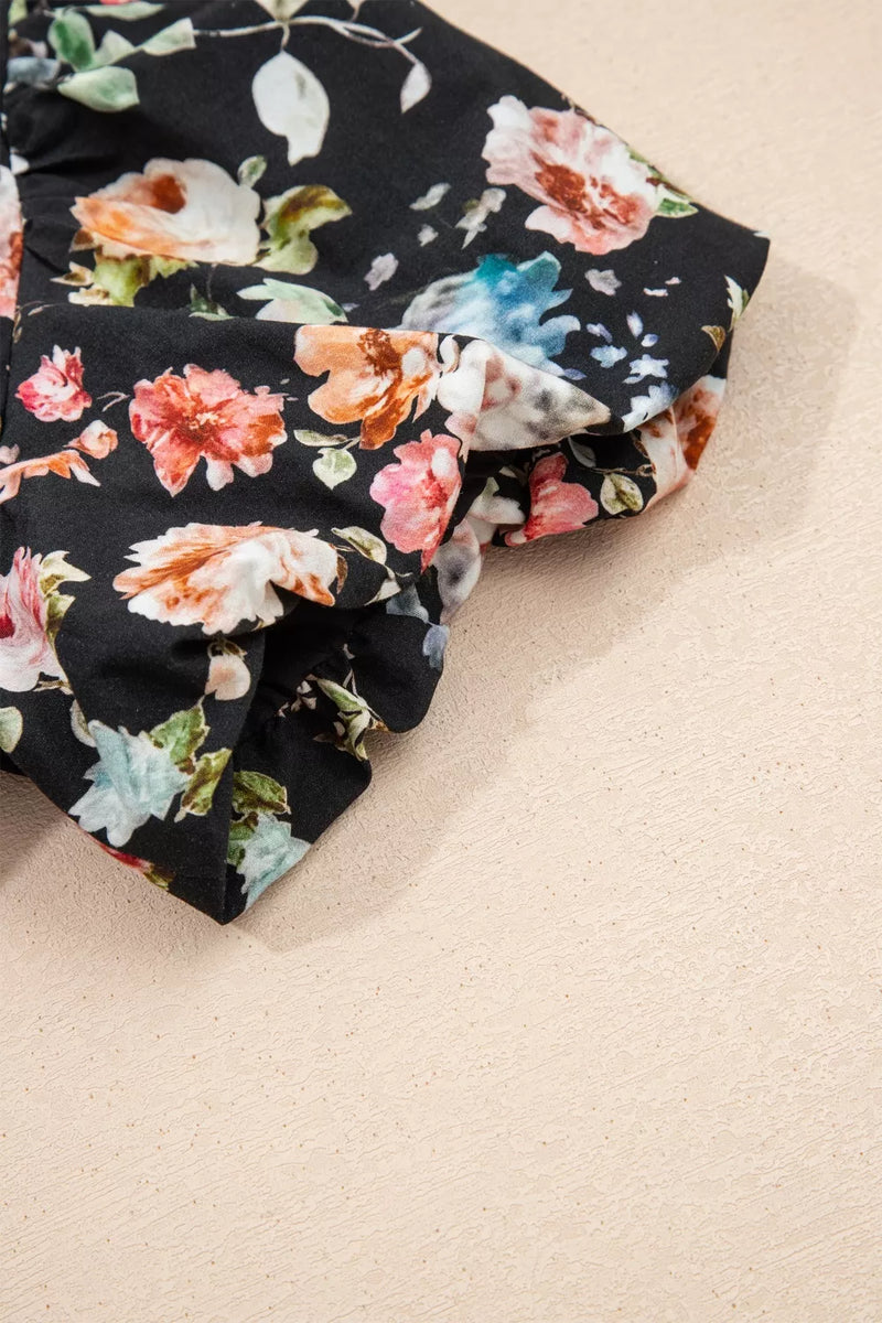 Floral fabric with black background on beige surface