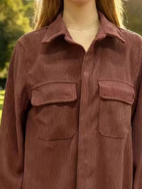 Brown corduroy shirt worn by a person with a blurred natural background