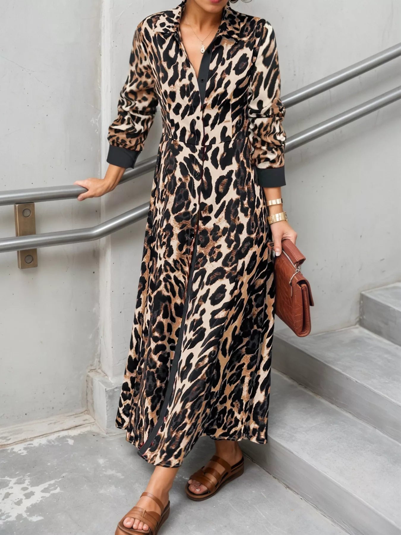 Person wearing a leopard print dress in an urban setting