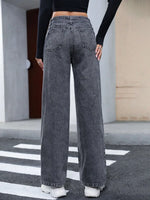 Person wearing wide-leg jeans in an urban setting