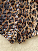 Leopard print fabric with sequins on a beige background