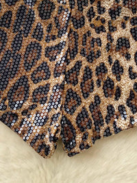 Leopard print fabric with sequins on a beige background